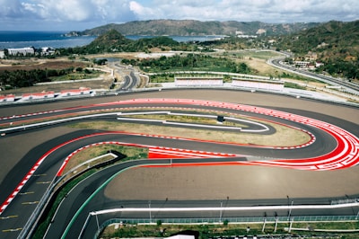 An aerial view of a race track with cars on it