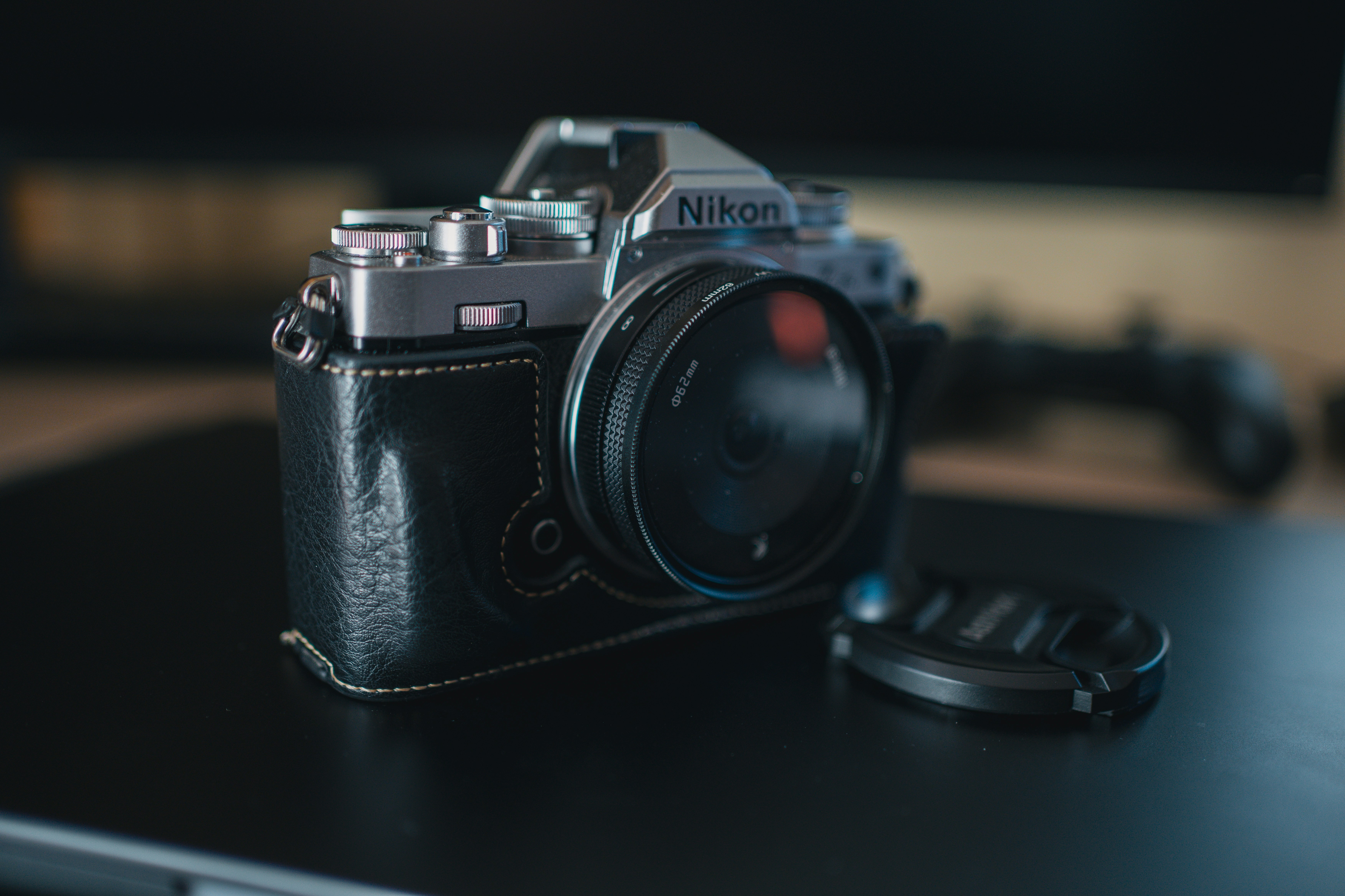 A camera sitting on top of a black table