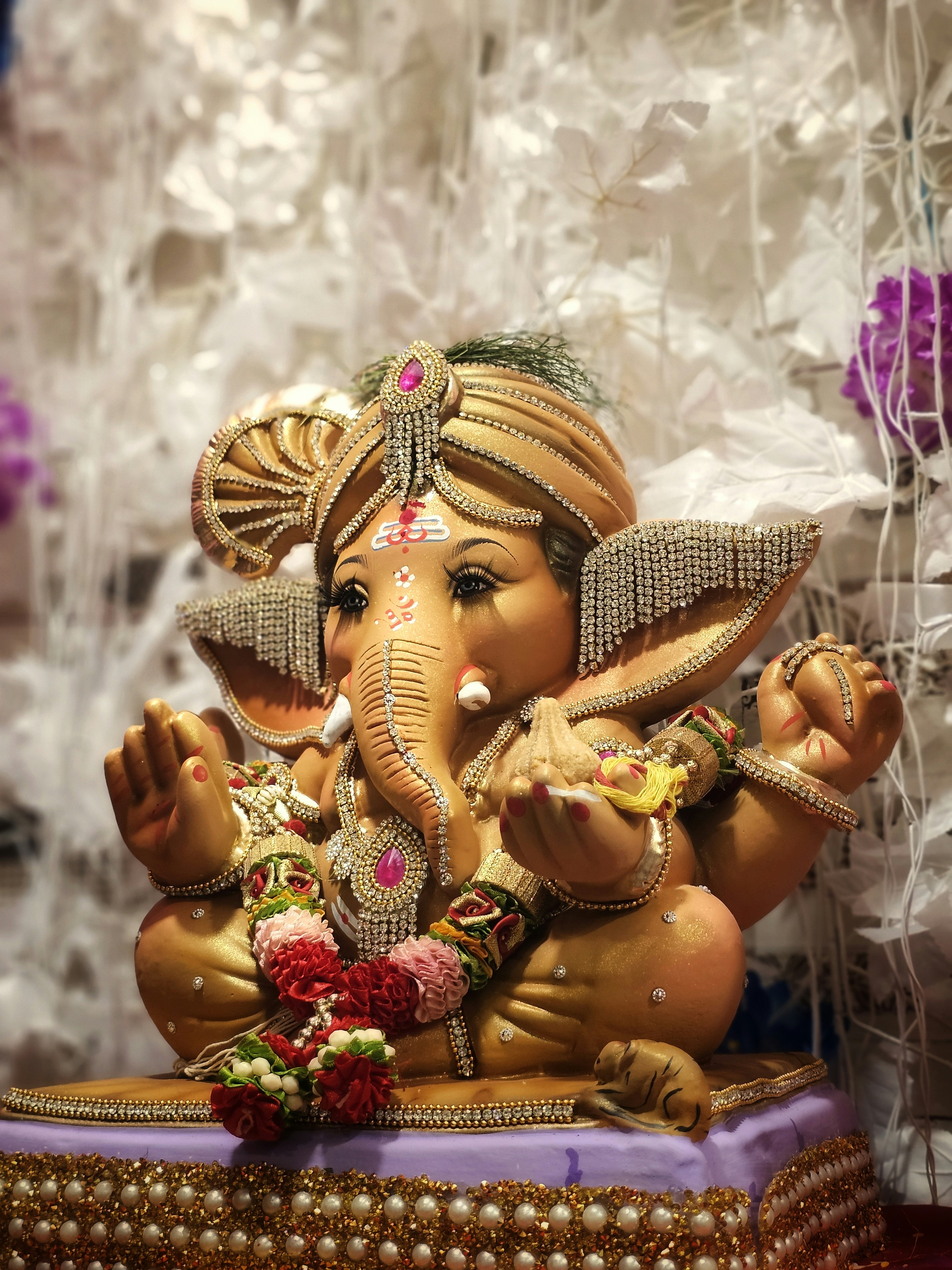 A statue of an elephant sitting on top of a table