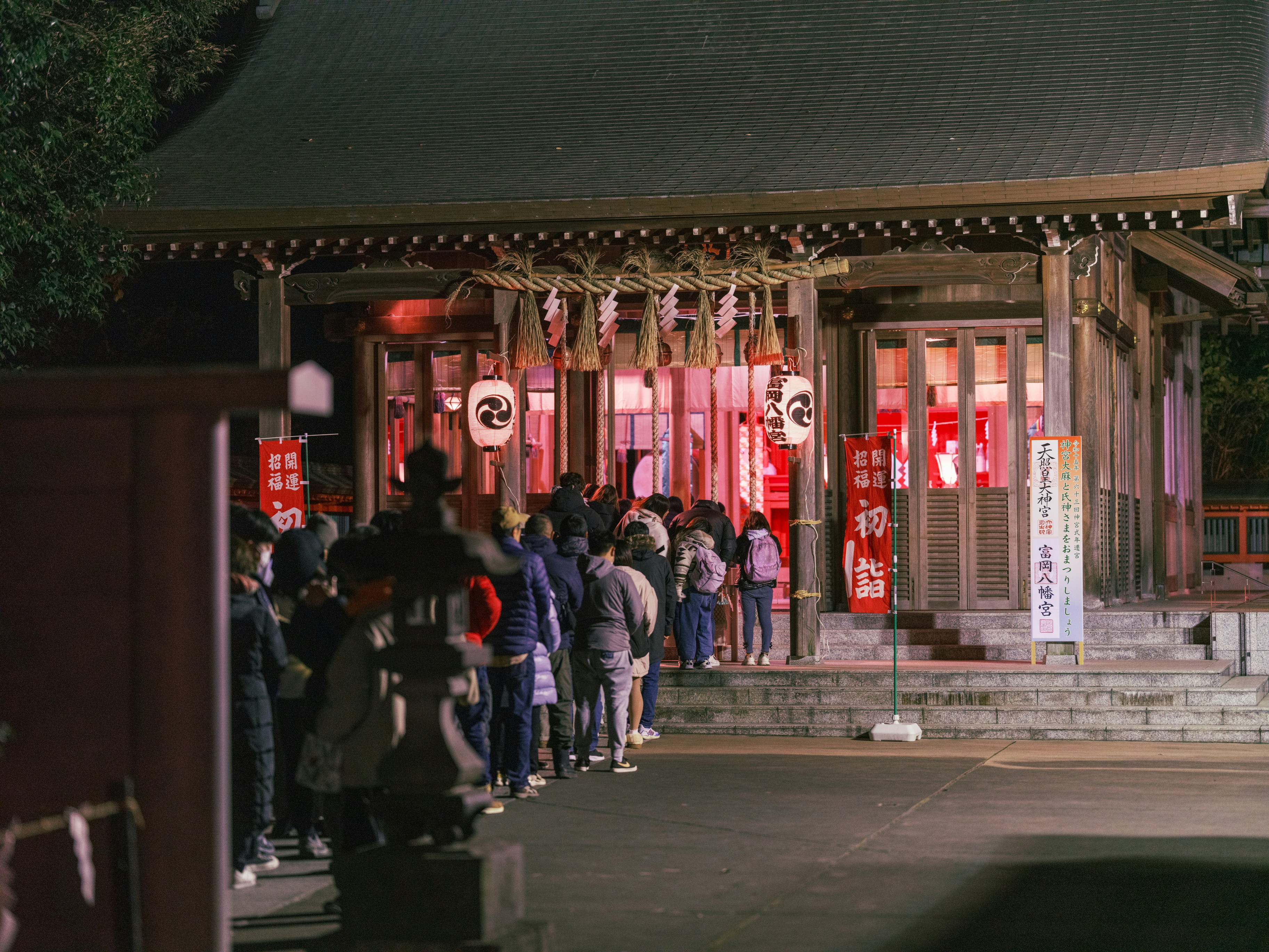 A group of people standing in front of a building