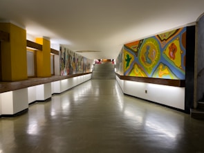 A long hallway with paintings on the walls