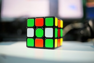 A rubik cube sitting on top of a table