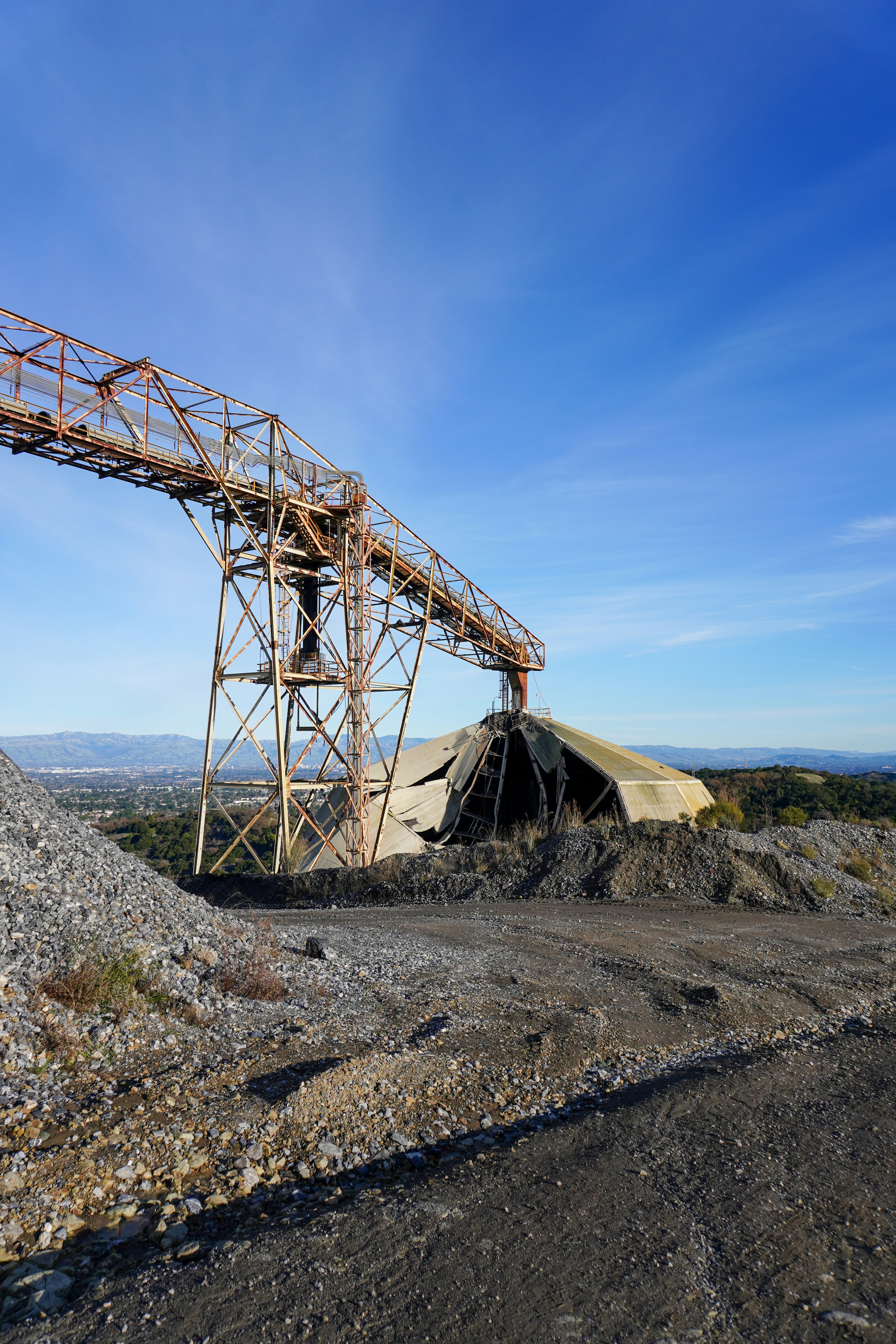A large metal structure sitting on top of a hill