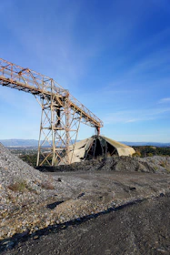 A large metal structure sitting on top of a hill