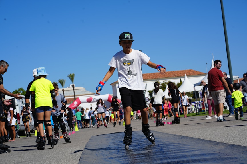 A man riding a skateboard down a street