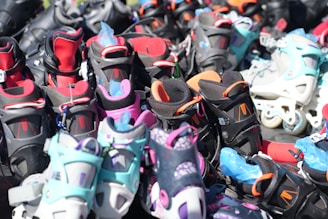 A bunch of shoes that are sitting on the ground
