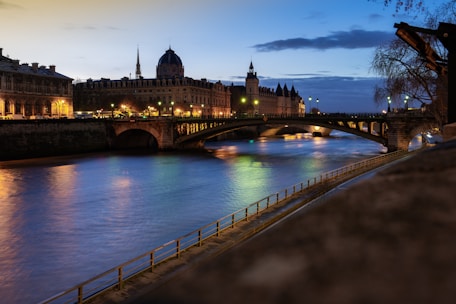 A river running through a city next to a bridge