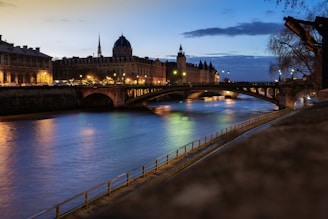A river running through a city next to a bridge
