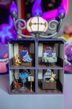 A toy house with a bunch of toys in it