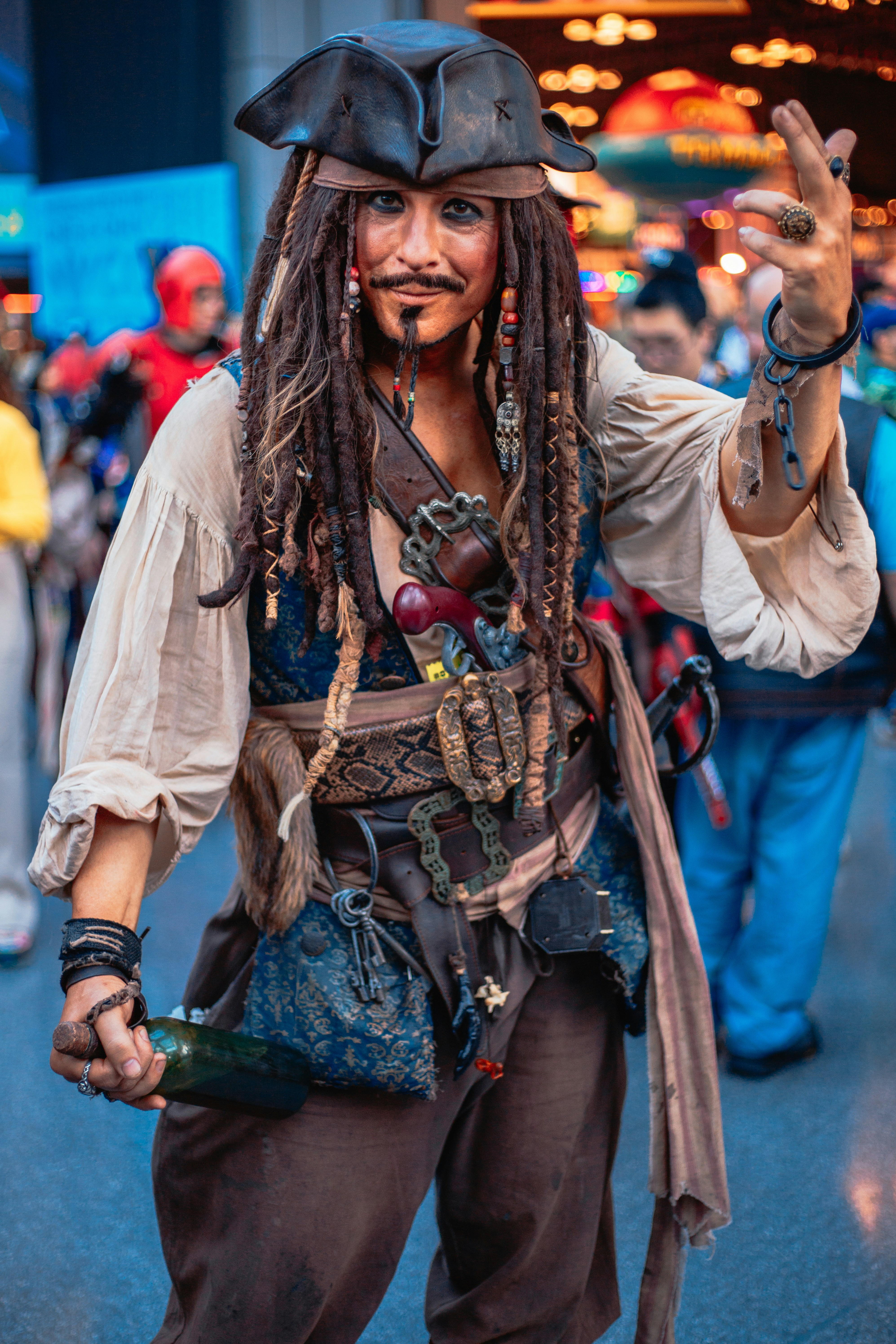 A man with dreadlocks and a pirate costume