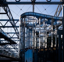 A large metal structure sitting under a blue sky