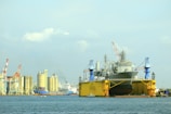 A large yellow and black boat in the water
