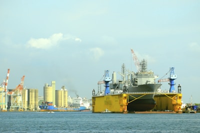 A large yellow and black boat in the water