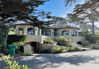 A large house with a lot of trees in front of it