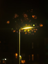 A street light in the dark with a blurry background