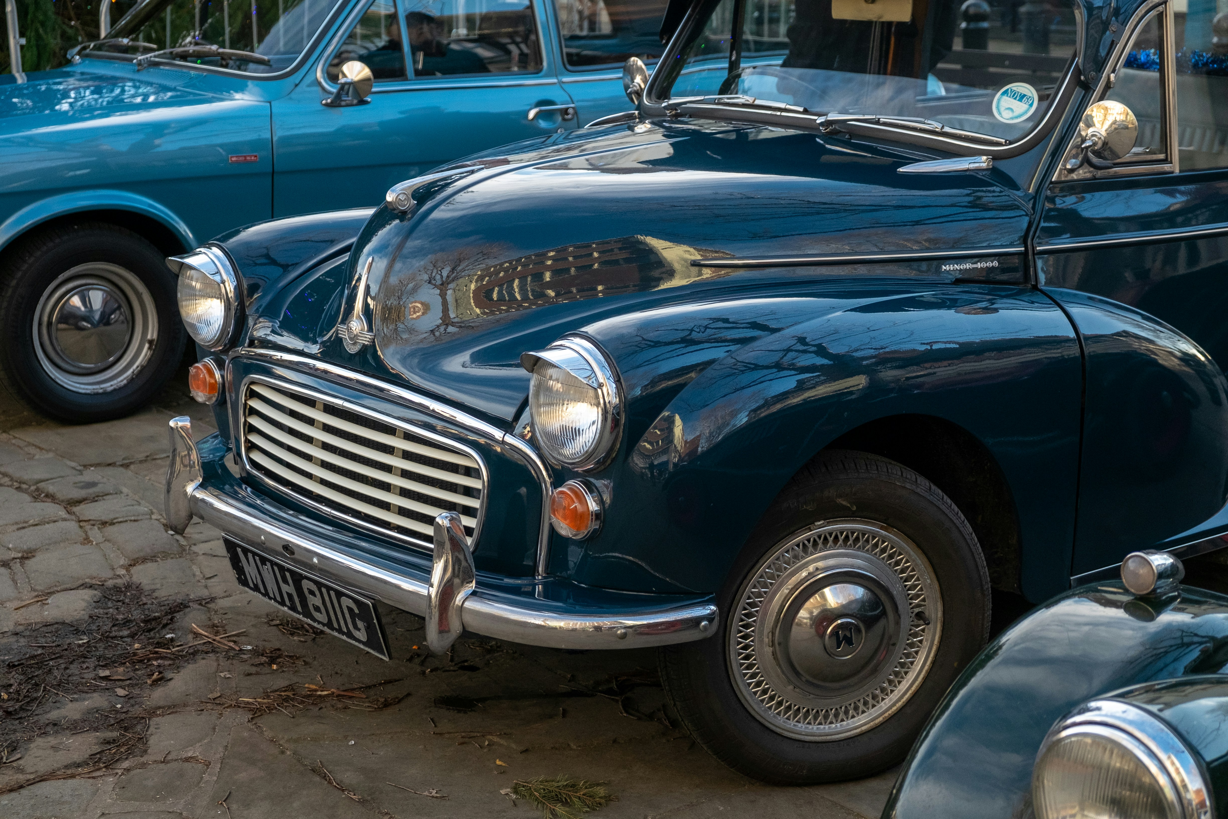 A row of old cars parked next to each other