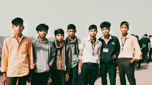 A group of young men standing next to each other