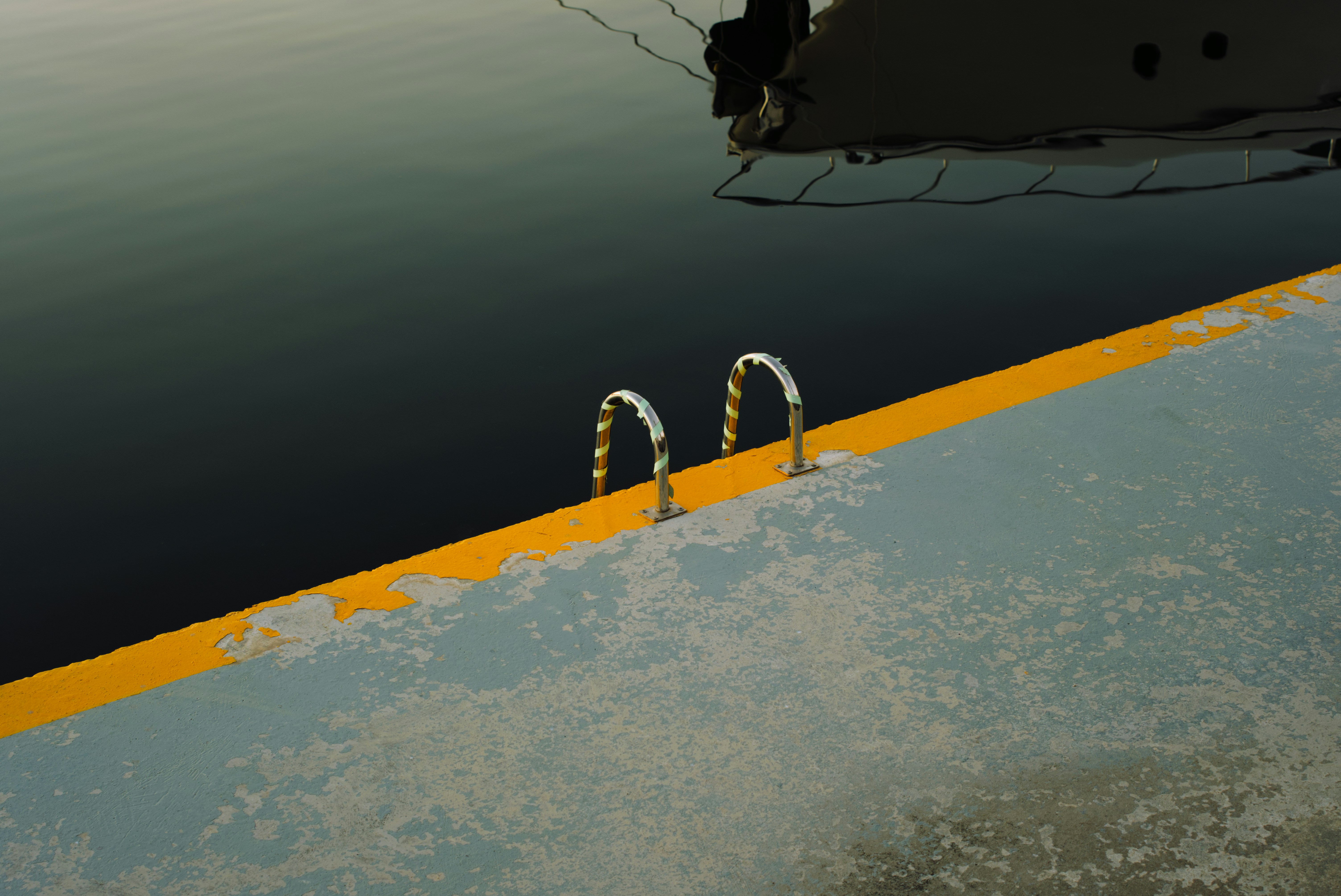 A painting of a boat in a body of water