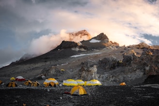 A group of tents set up on a mountain