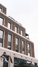A tall brick building with lots of windows