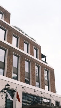 A tall brick building with lots of windows
