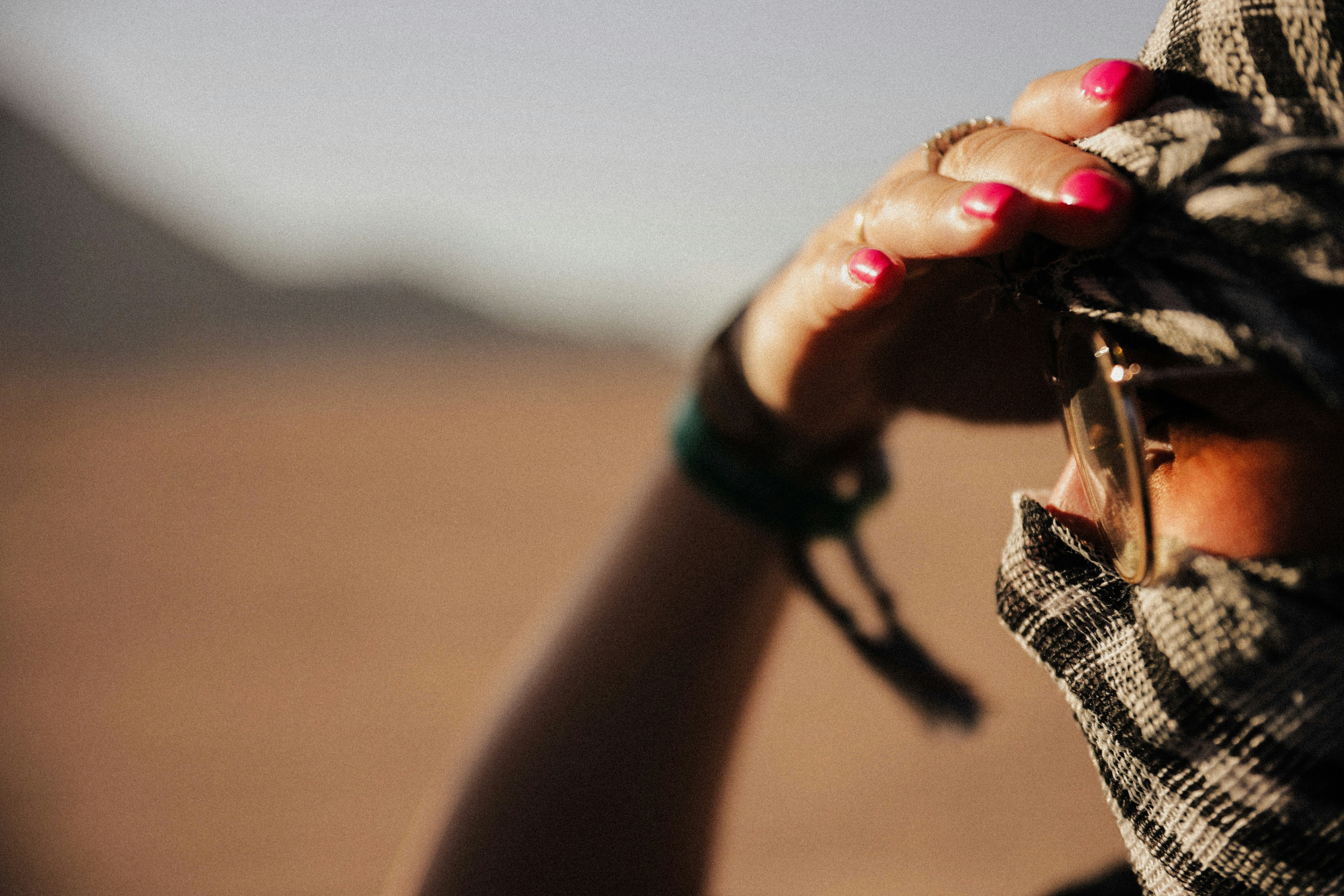 A woman wearing a scarf covering her face