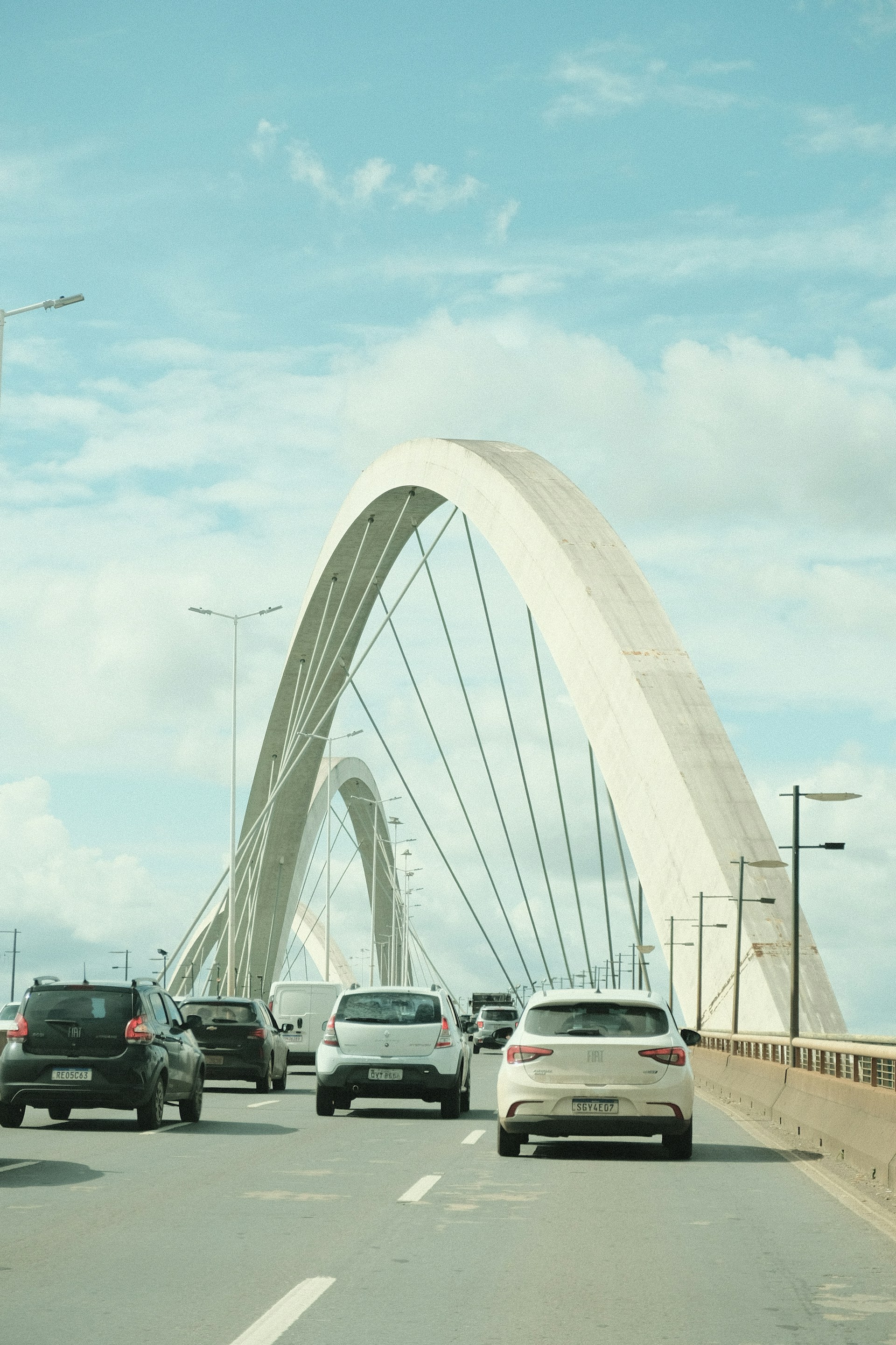 A bunch of cars that are on a road
