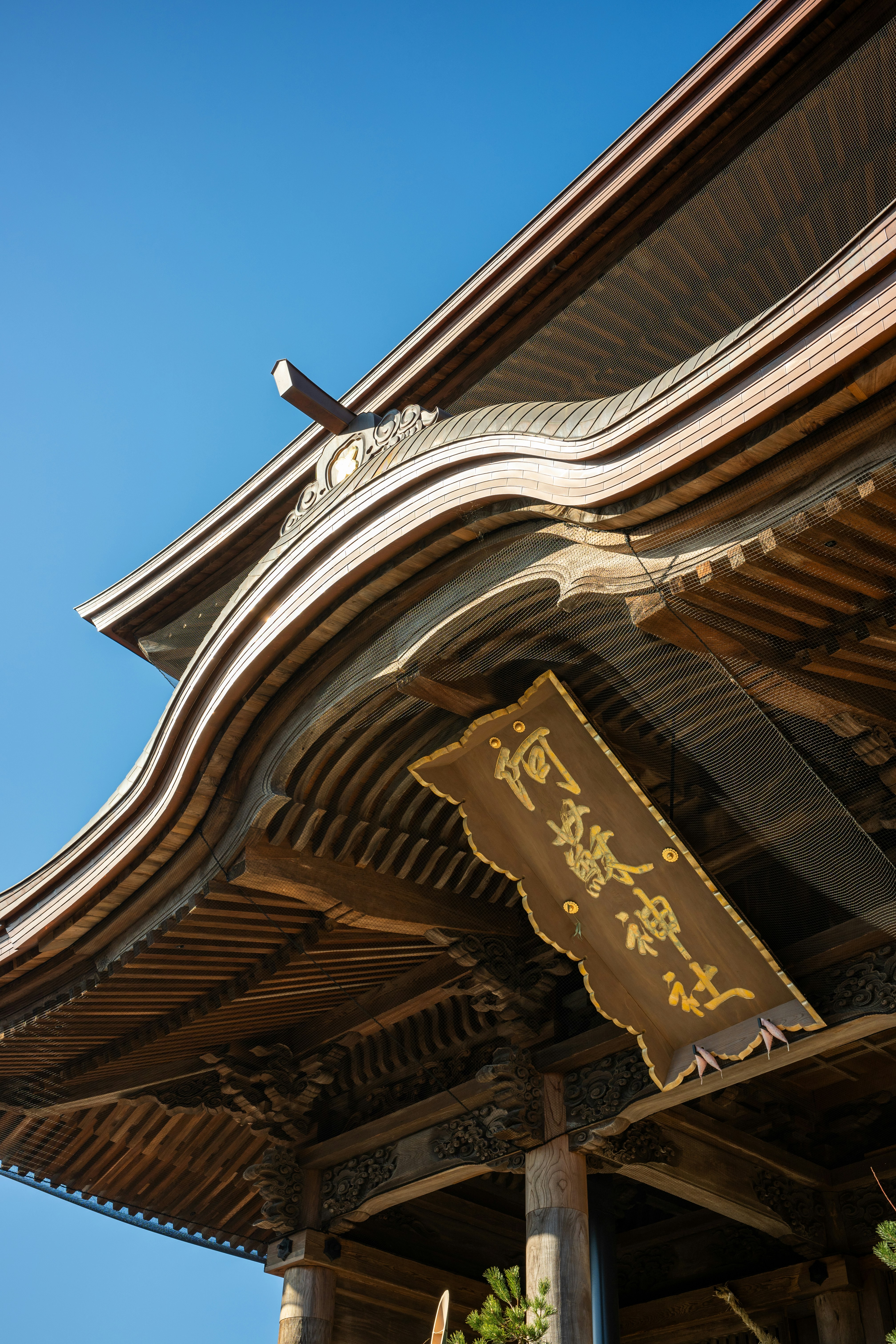 The roof of a building with a cross on it
