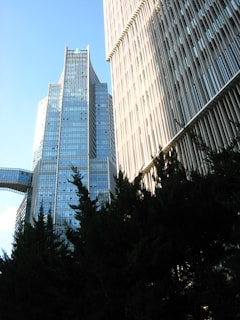 A tall building with a bridge in the background