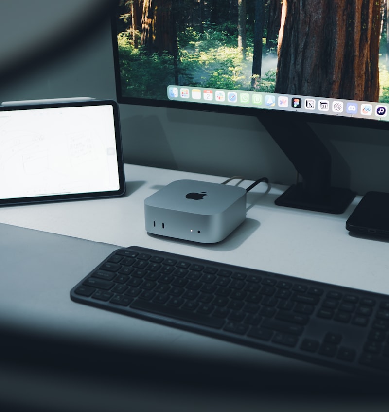 Mac Studio desktop unit on a desk with display