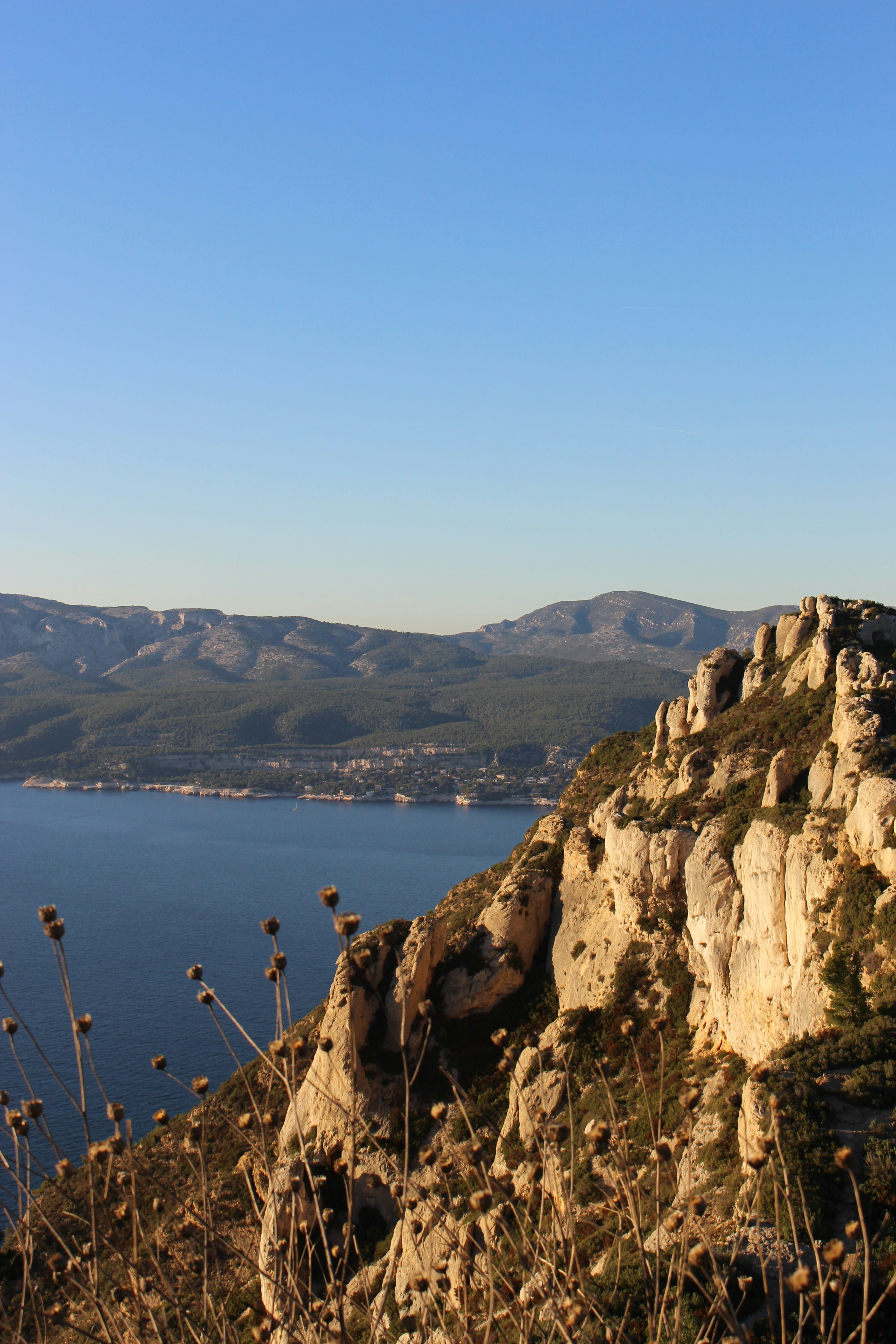 A view of a body of water with mountains in the background