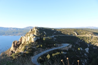 A winding road on the side of a mountain