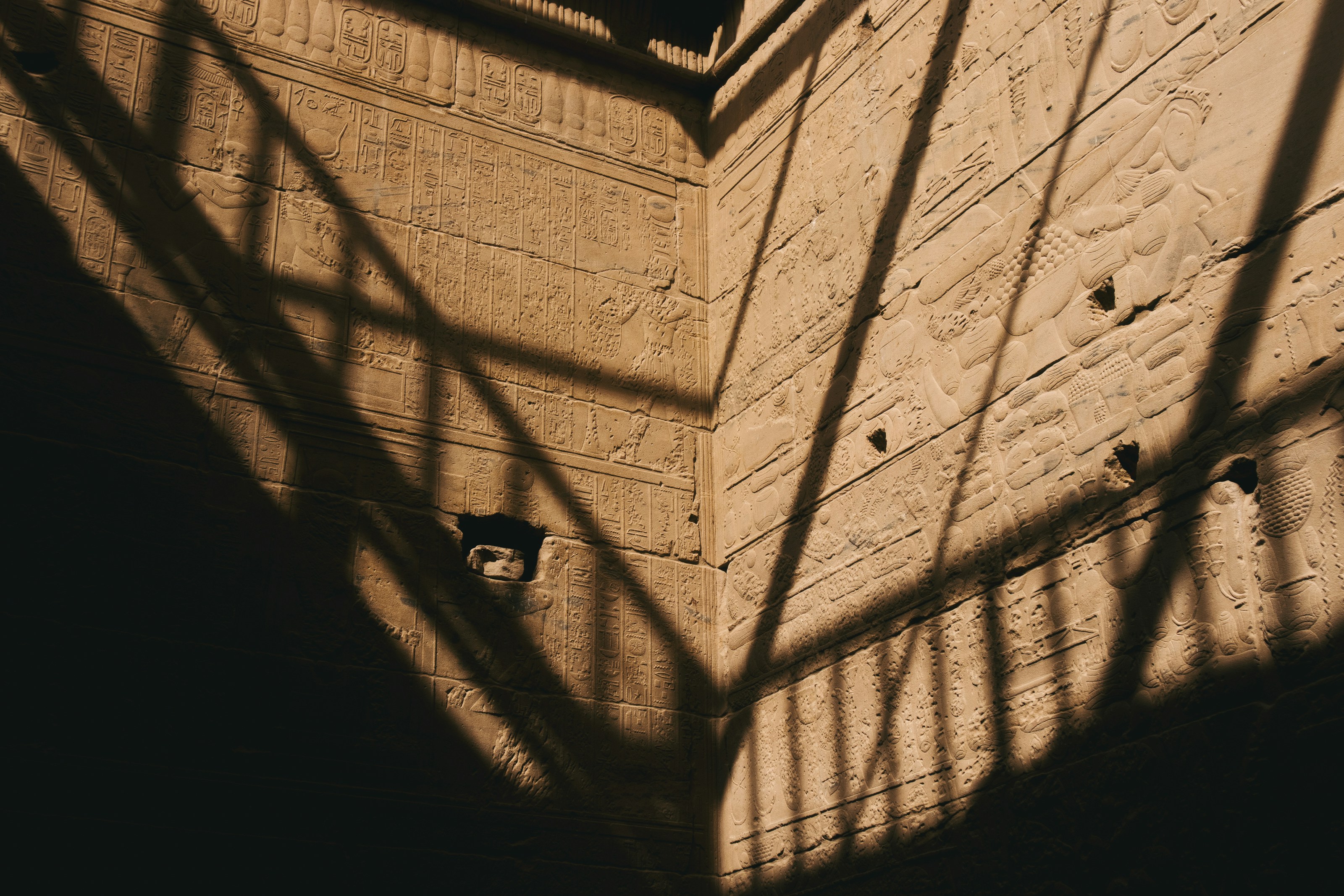 The shadow of a clock tower on a building