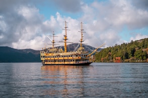 A large boat floating on top of a large body of water