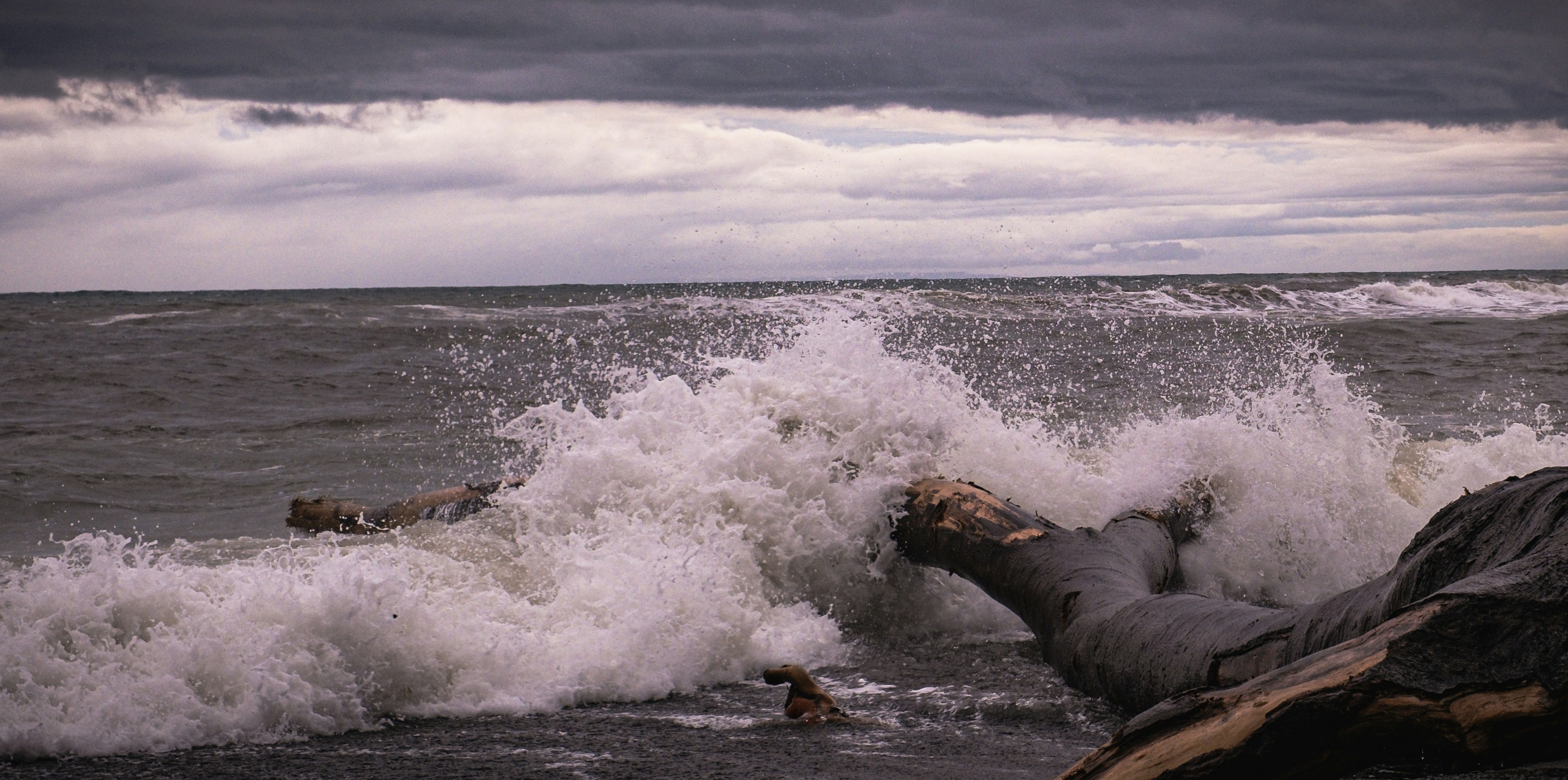 A large body of water with waves crashing over it