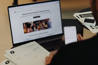A man sitting in front of a laptop computer