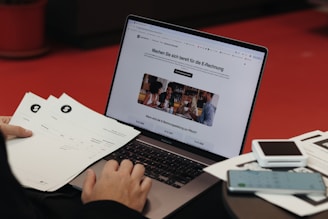 A person sitting in front of a laptop computer