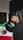A man with headphones on holding a mexican flag