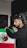 A man with headphones on holding a mexican flag