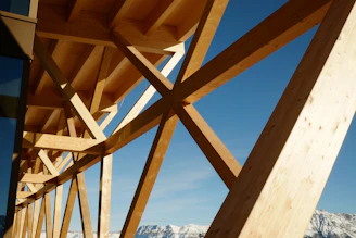 A wooden bridge with mountains in the background