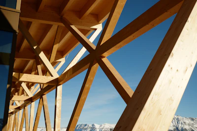 A wooden bridge with mountains in the background