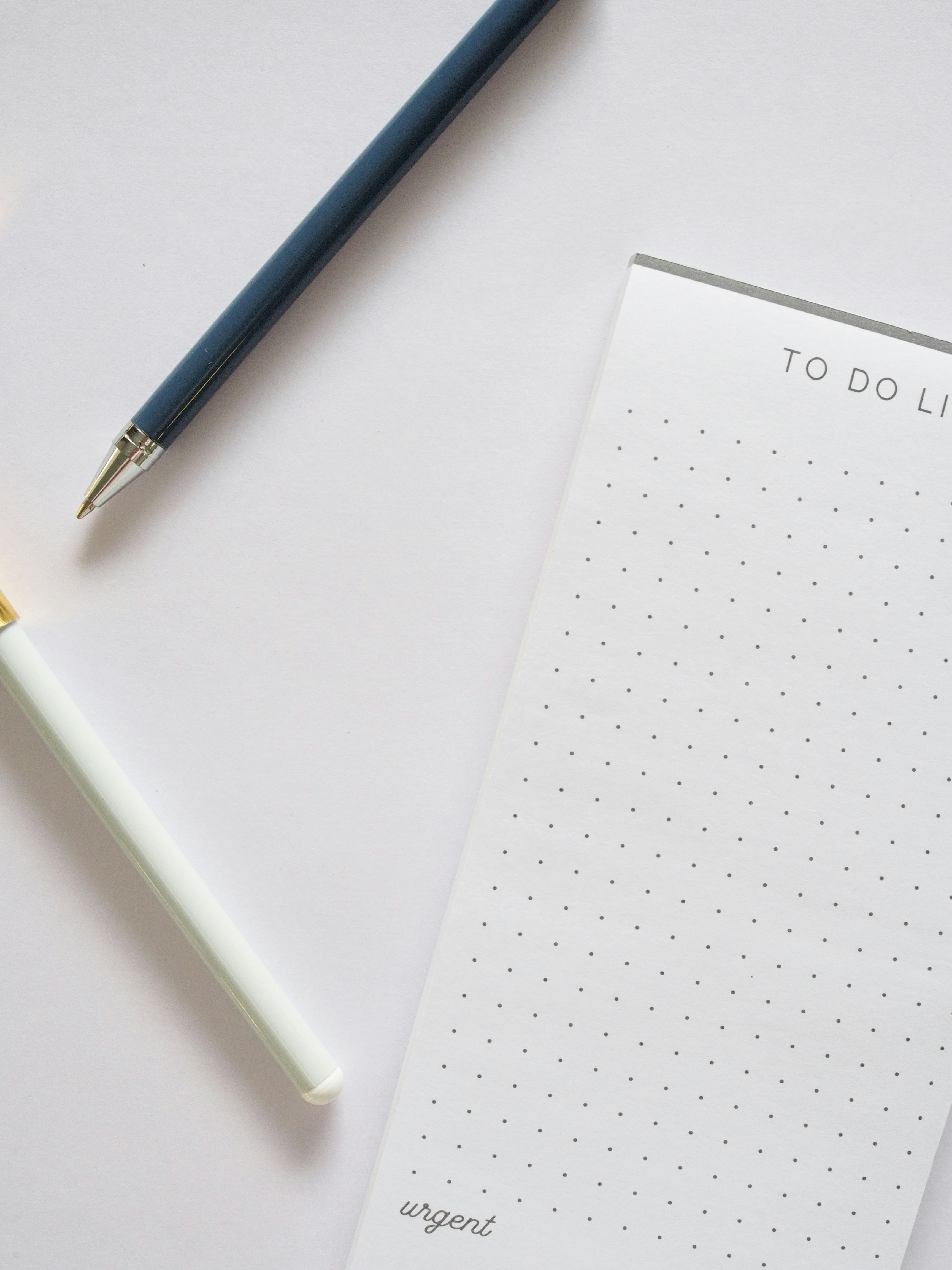 A notepad with a pen next to it