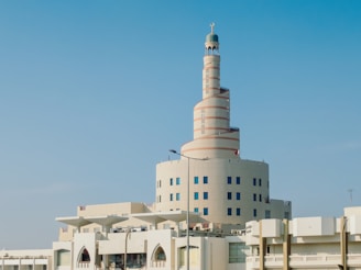 A tall white building with a clock on it's side