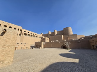 A large brick building with a sky background