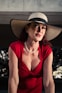 A woman in a red dress and a hat