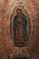A painting of the virgin mary in a church
