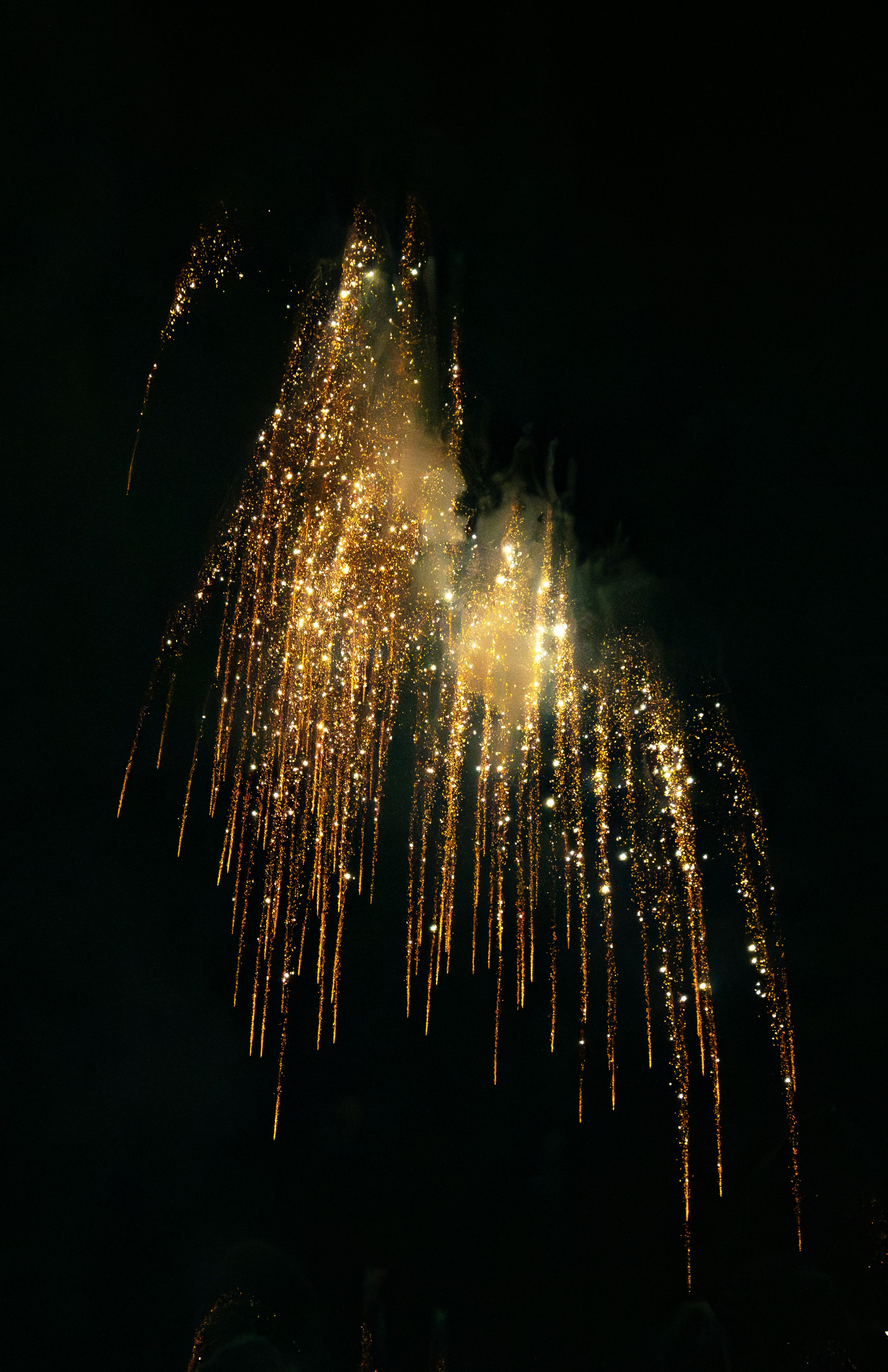 A large fireworks display in the night sky