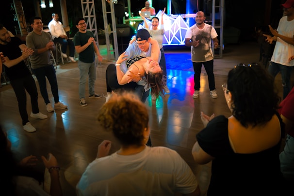 A group of people standing around each other