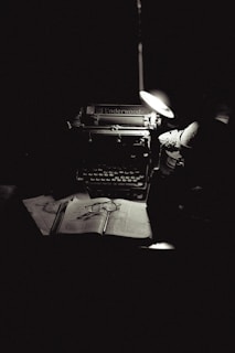 A black and white photo of an old typewriter