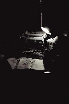 A black and white photo of an old typewriter